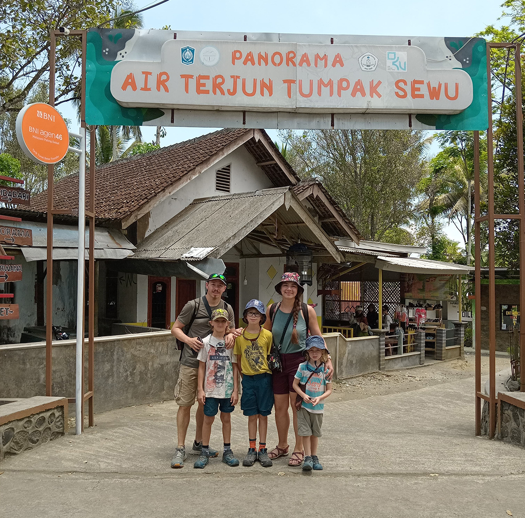 Scenic view of Kawah Ijen volcano at sunset with colorful sky and crater lake